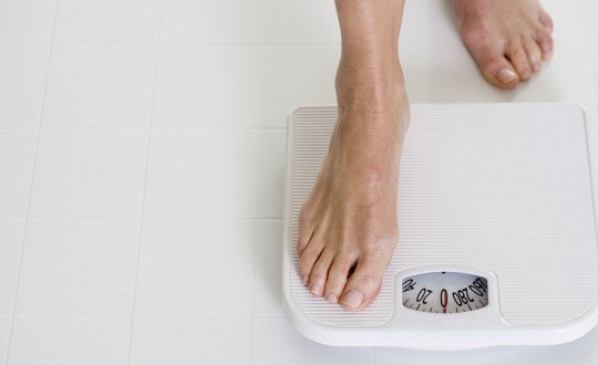 Woman Stepping onto Scale