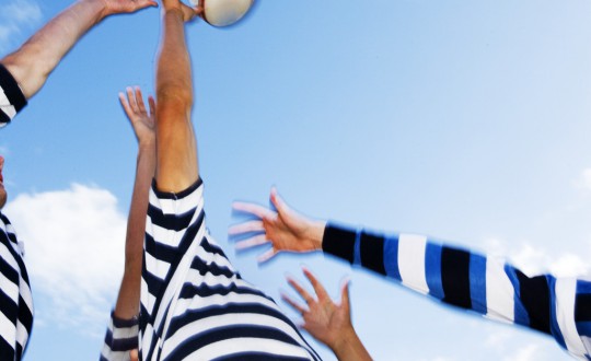 Rugby Players Jumping for Ball